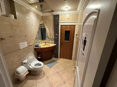 a bathroom with a toilet and a sink at Cozy & Equipped Room Right Next to Mall & Skytrain in Vancouver