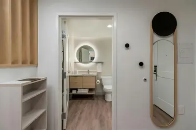 a bathroom with a sink and a mirror at TownePlace Suites by Marriott Victoria Airport Sidney in Sidney