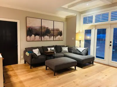 a living room with a couch and a table at Ride and Climb Lodge in Squamish