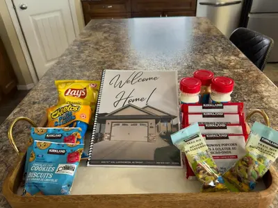a table with a basket of food and snacks at Spacious 4BR with King Suite - Garage - Netflix in Lloydminster