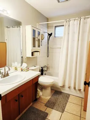 a bathroom with a toilet and a sink and a shower at House in Edmonton