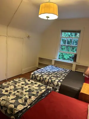 a bedroom with two beds and a window at Vancouver Airport & UBC Private Rooms - Free Parking, Fast Wifi in Vancouver