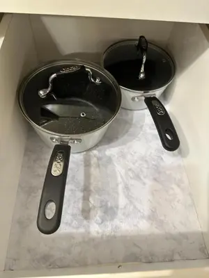 two measuring utensils sitting on top of a counter at 2-Bedroom Private Suite near VIU in Nanaimo