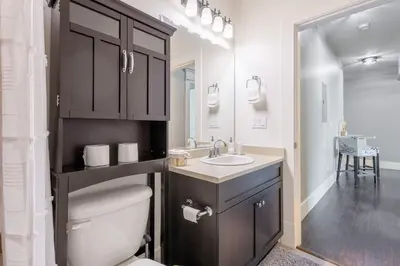 a bathroom with a toilet and a sink and a mirror at Beautiful abode in Abbotsford in Abbotsford