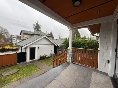 a porch of a house with a fence at YVR3106 | Cozy 3BR in Central Vancouver | 15 min to Downtown in Vancouver