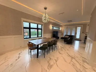 a large dining room with a table and chairs at YVR3106 | Cozy 3BR in Central Vancouver | 15 min to Downtown in Vancouver