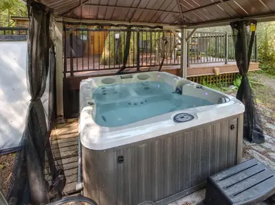 a hot tub in a gazebo at Hot tub Oasis Among Trees - Pet Friendly in Port Renfrew