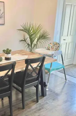 a dining room with a wooden table and chairs at Cozy Large Family Home near Lake, AC, Full Kitchen in Calgary