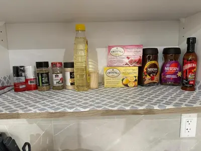 a shelf in a refrigerator with spices and oils at Cozy 3 beds 2 and half baths 2 Story Home in Calgary