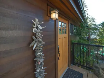 a group of fish on the side of a house at Tiltin Hilton- Ocean View - Pet Friendly - sleep 4 in Port Renfrew