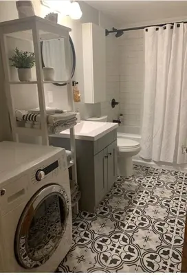 a bathroom with a washer and a washing machine at Beautiful Oasis in prime Vancouver BC with 2 bed and patio PLUS Studio available in Vancouver