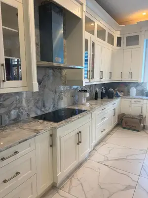 a kitchen with white cabinets and a sink at Comfortable Private Room in a Shared Home in Richmond