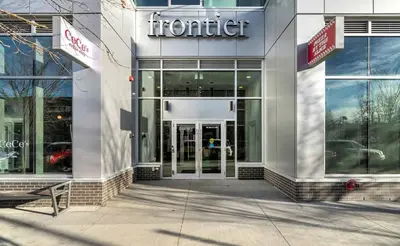 a store front with the front door of a car dealership at Family Condo w Kids Den FREE Banff Pass in Calgary