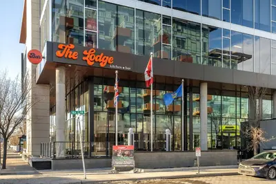 a building with a sign on the side of it at Family Condo w Kids Den FREE Banff Pass in Calgary
