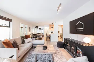 a living room with a couch and a fireplace at Wintergreen 26 by Outpost Whistler in Whistler