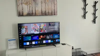 a flat screen tv sitting on a wall at Modern Coastal 2BR Retreat with Private Hot Tub in Vancouver BC in West Vancouver