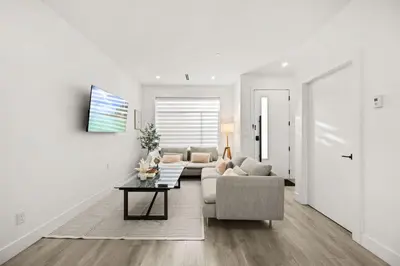 a living room with a couch and a table at Bright Modern 3 Bedroom Suite in Vancouver in Vancouver