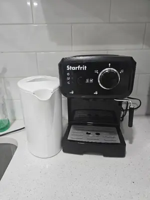 a blender sitting on a counter next to a bucket at Cy Becker Drive 2023 Luxury Home in Edmonton