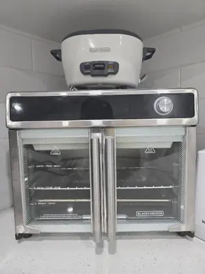 a stove top oven with a pot on top of it at Cy Becker Drive 2023 Luxury Home in Edmonton