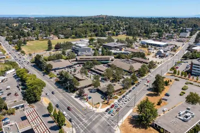 an aerial view of a city with a parking lot at 2 Bedroom 1 Bath On An Oak Tree Lined End Street On The Galloping Goose in Victoria
