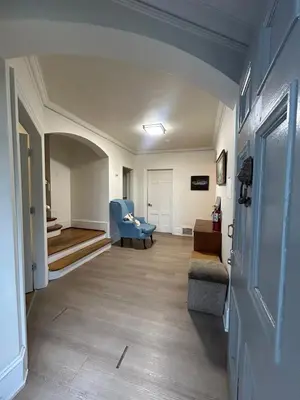 a living room with a couch and a chair at Vancouver Budget Stay - Airport 10 Min - Free Parking & Fast WiFi in Vancouver
