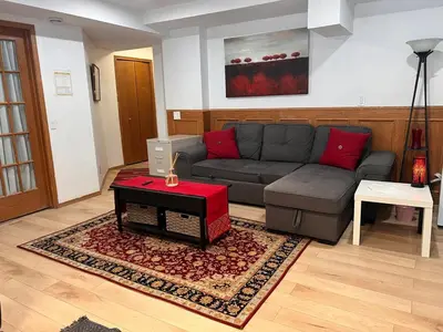 a living room with a couch and a table at Cozy home in Calgary