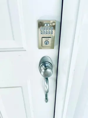 a door knob on a white door at Spacious 3BR Retreat w-Hot Tub Ravine Sleeps 9 in Edmonton