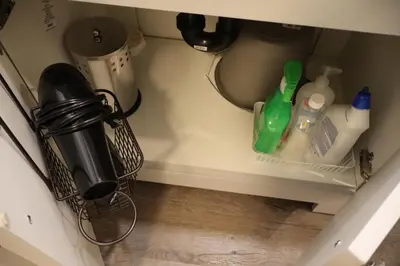 a corner of a kitchen counter with bottles and detergents at Cozy and Private Guest Suite in West Edmonton in Edmonton