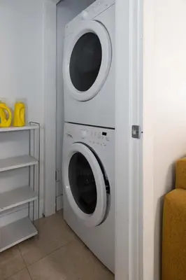 a white washer and dryer in a room at Private 2BR 2Bath Suite - Sunset Vancouver in Vancouver