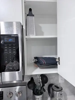 a kitchen with a sink and a microwave at The Cozy Spot in Edmonton