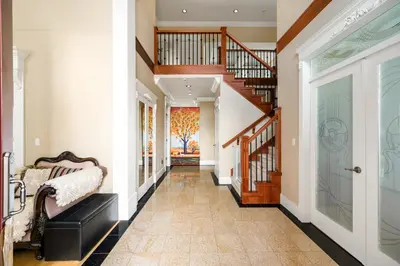 a hallway of a home with a staircase and a stair case at Cozy Private Space in Richmond with Modern Comforts in Richmond