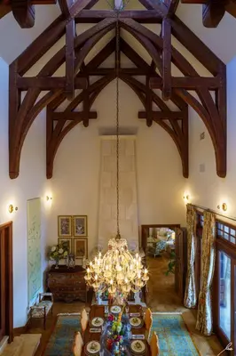 a dining room with a chandelier hanging from the ceiling at Chateau Okanagan in Kelowna