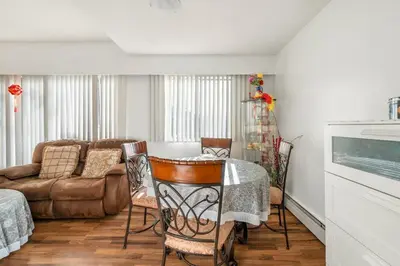 a living room with a table and a couch at Central Vancouver 1BR Close to Transit in Vancouver