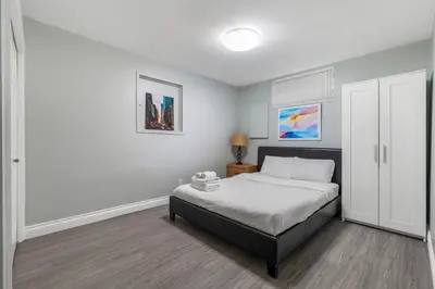a bedroom with a bed in a room at Comfortable Westside Vancouver Stay in Vancouver