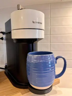 a coffee maker sitting on top of a coffee cup at Modern & Stylish Condo in Langley City in Langley