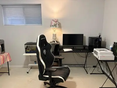 an office with a desk with a computer and a chair at Private Room near Scottsdale Shopping Centre in Bélanger
