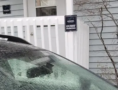 a car windshield with a sign in front of a garage at Aurora views from 2 br apartment by lake in Yellowknife