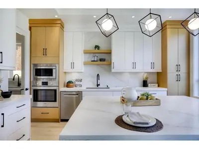 a kitchen with white cabinets and a white counter top at BRAND NEW LUXURY 4 Beds 4 baths Home Langley Perfect for Families and Groups in Langley