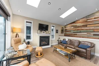 a living room with a couch and a fireplace at Wild Beauty - Oceanview - Pet Friendly - sleep 2 in Port Renfrew