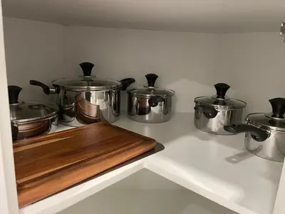 a group of pots and pans on a kitchen stove at Modern Comfort in NW Calgary in Calgary