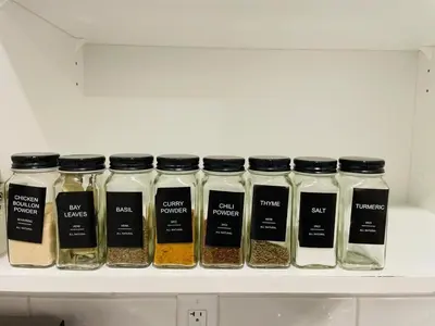 a row of spices in glass jars on a shelf at Modern Comfort in NW Calgary in Calgary
