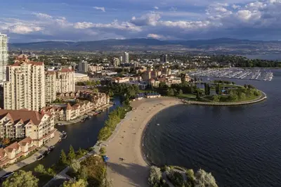 an aerial view of a beach next to the water at Queen bedroom suite with private bathroom and independent entrance in Kelowna