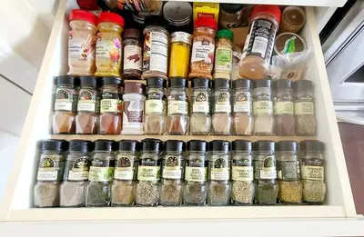 a refrigerator filled with lots of different types of spices at Family Retreat Hot Tub Banff and Calgary DT Access in Calgary