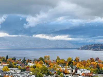 a view of a city and a body of water at Signature Iconic Lakeview Downtown 2-Bedroom Loft in Kelowna