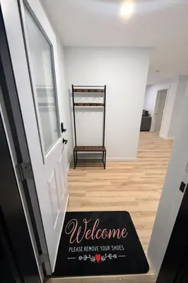 a welcome mat on the floor of a stairway at Private 1BR Suite with Kitchen, Laundry, Parking & 1 Gigabit Internet in Whitehorse