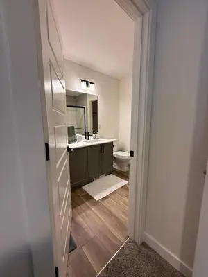 a bathroom with a sink and a toilet at Fort Home in Fort Saskatchewan