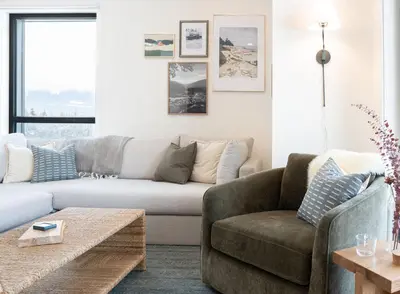 a living room with a couch and a coffee table at Powder and Par Penthouse by Revelstoke Vacations in Revelstoke