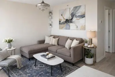 a living room with a couch and a table at Chic 2BR Tinseltown Condo - Walk to Stadiums in Vancouver