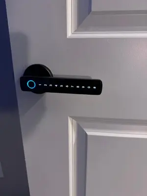 a black door handle on a white door at NorthEdge Master Suite, Leduc in Leduc