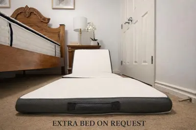 a mattress sitting on the floor in a bedroom at Private Suite in Airdrie Near Calgary Free Parking in Airdrie